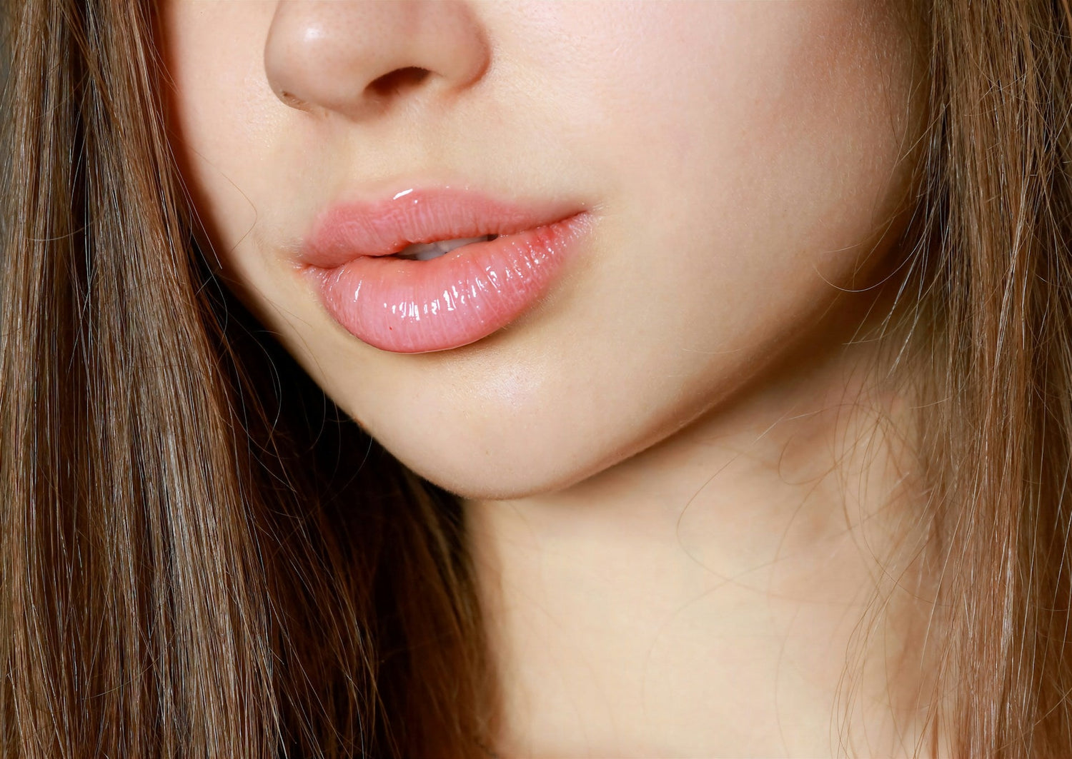 woman-applying-lip-balm-for-soft-and-moisturized-lips