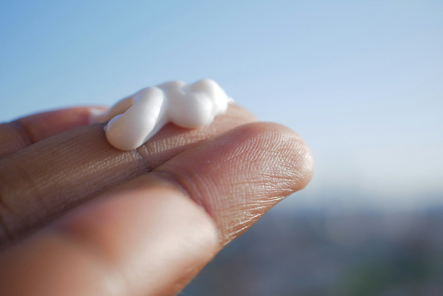 woman-applying-moisturizing-cream-to-her-hands-for-soft-skin