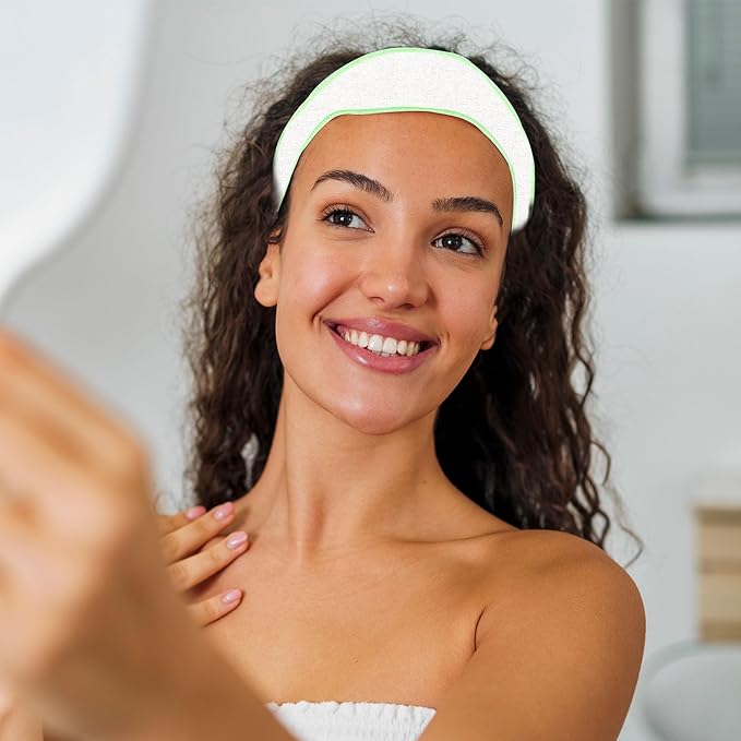 brown-haired-woman-looking-in-a-mirror-and-smiling